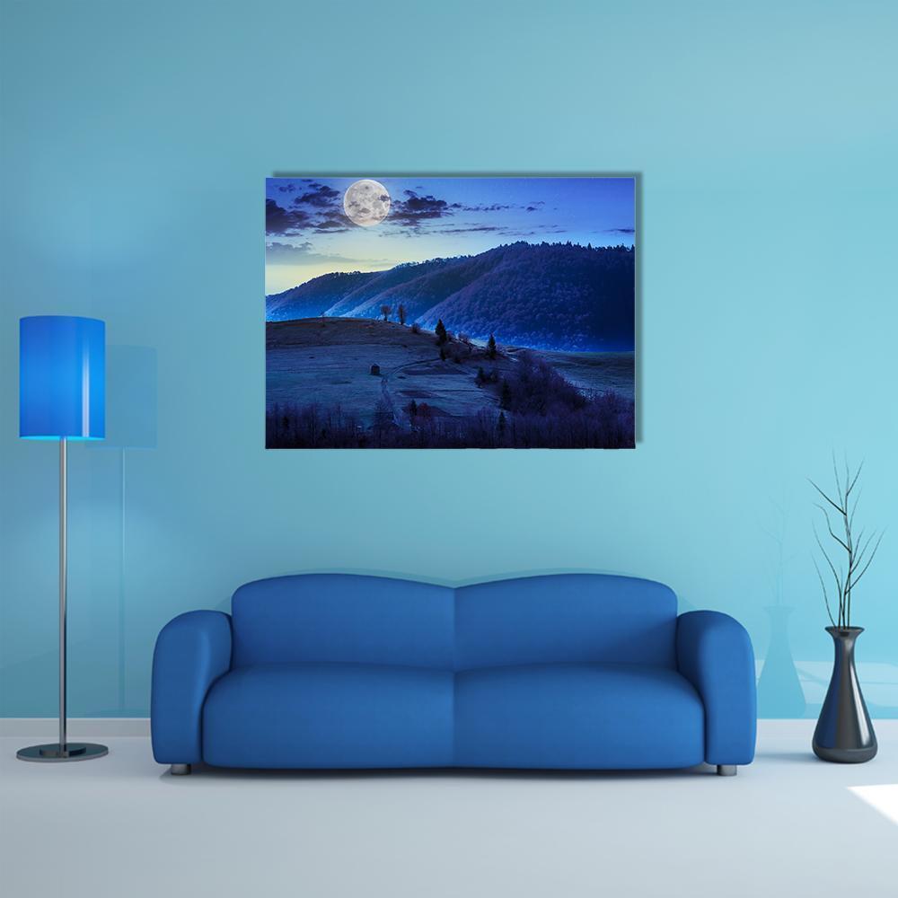 Moonlit Mountain Landscape Canvas Wall Art in blue, navy and purple, single panel hung on a wall