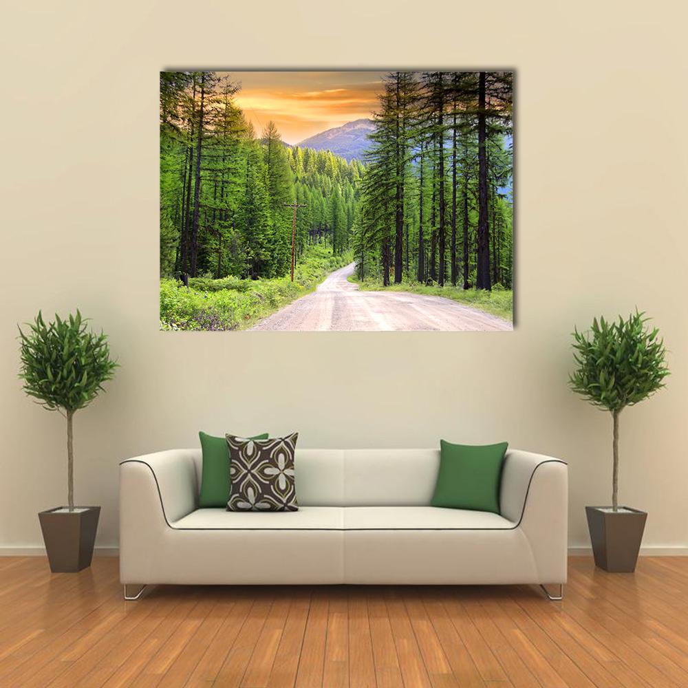 Gravel Road Through Conifer Forest Canvas Wall Art in beige, orange and green, single panel hung on a wall