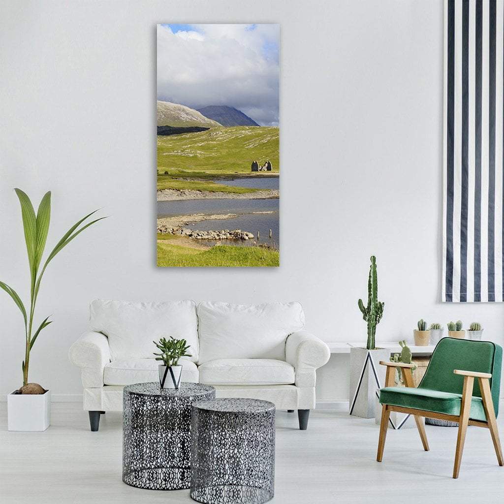 Scottish Summer Hills and Lake Vertical Canvas Wall Art in gray, green and blue, single vertical panel hung on a wall