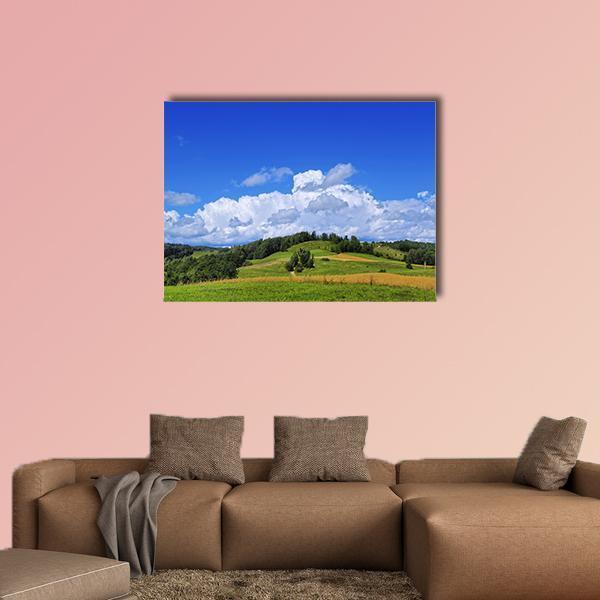 Summer Hills with Yellow Fields Canvas Wall Art in yellow, green and blue, single panel hung on a wall