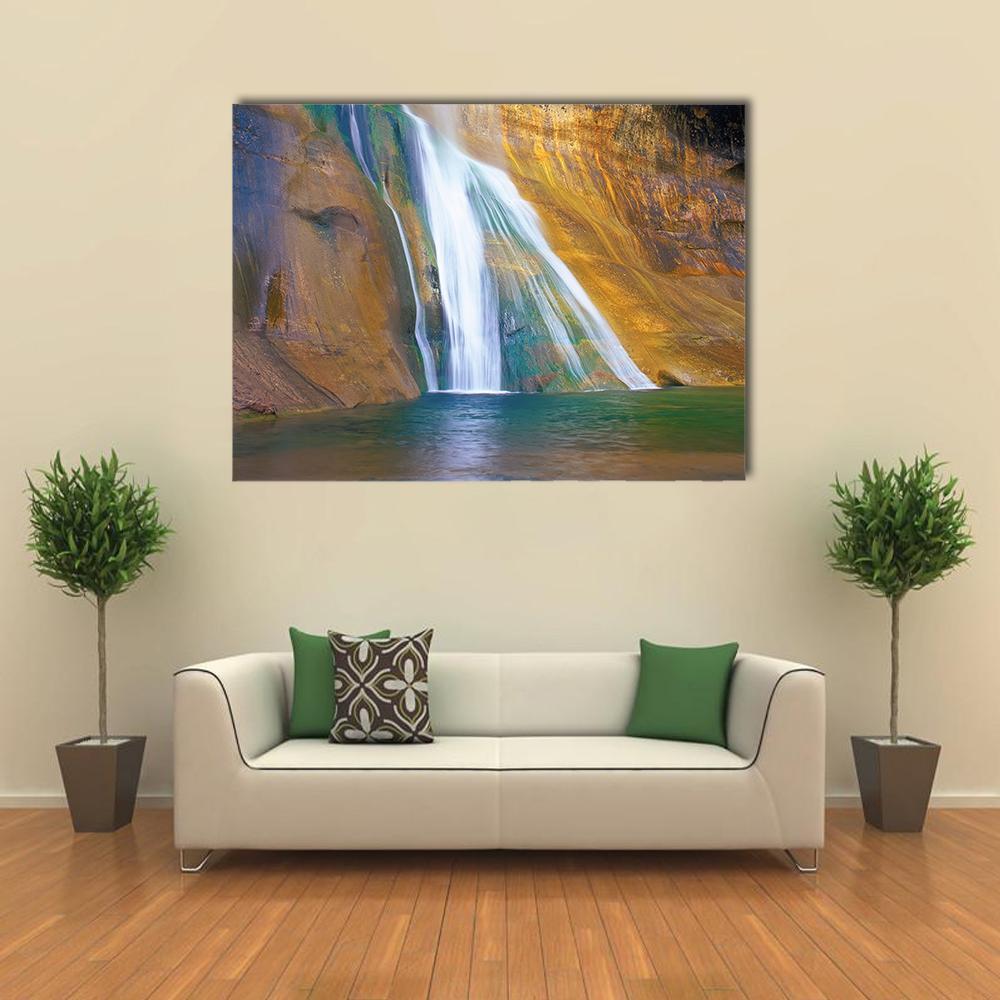 Lower Calf Creek Falls Canvas Wall Art in brown, yellow and blue, single panel hung on a wall
