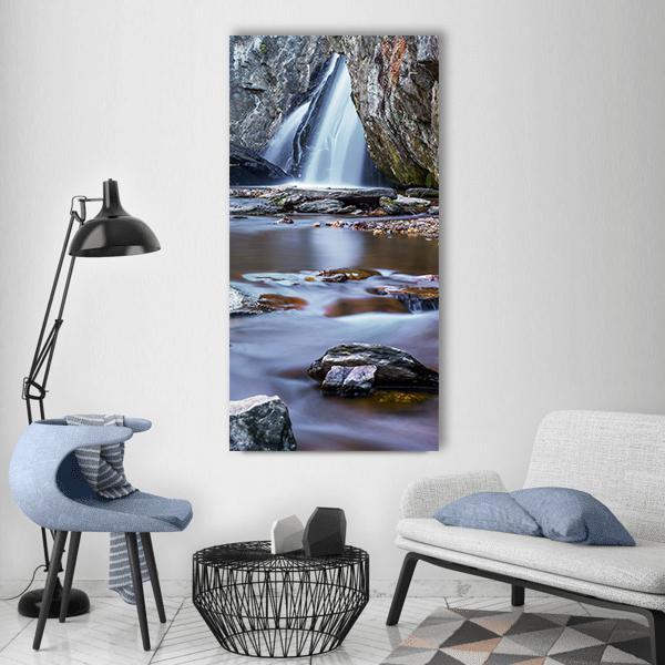 Forest Waterfall and River Vertical Canvas Wall Art in white, gray and blue, single vertical panel hung on a wall