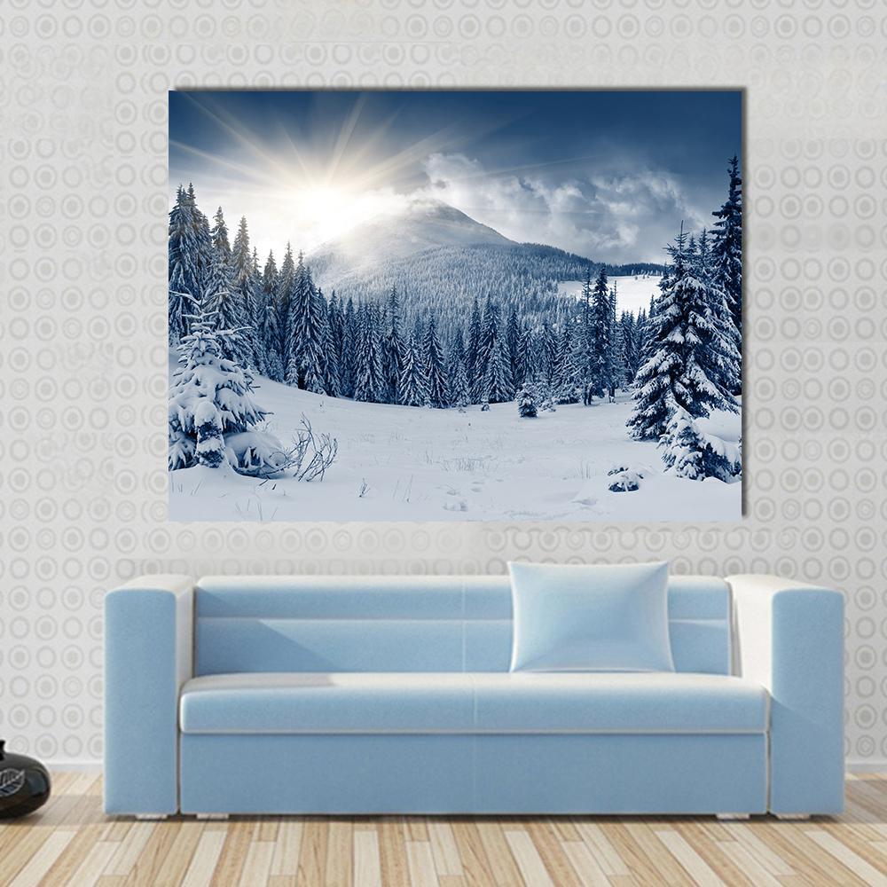 Winter Landscape and Snow Covered Trees Canvas Wall Art in white, gray and blue, single panel hung on a wall