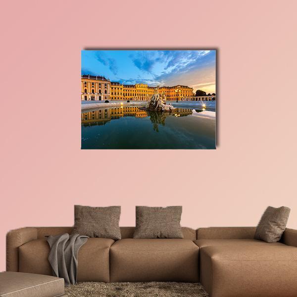 Schonbrunn Palace with Fountain Reflection Canvas Wall Art in orange, yellow and blue, single panel hung on a wall