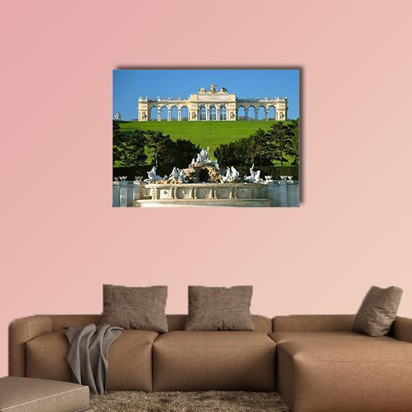 Schonbrunn Palace with Neptune Fountain Canvas Wall Art in beige, green and blue, single panel hung on a wall