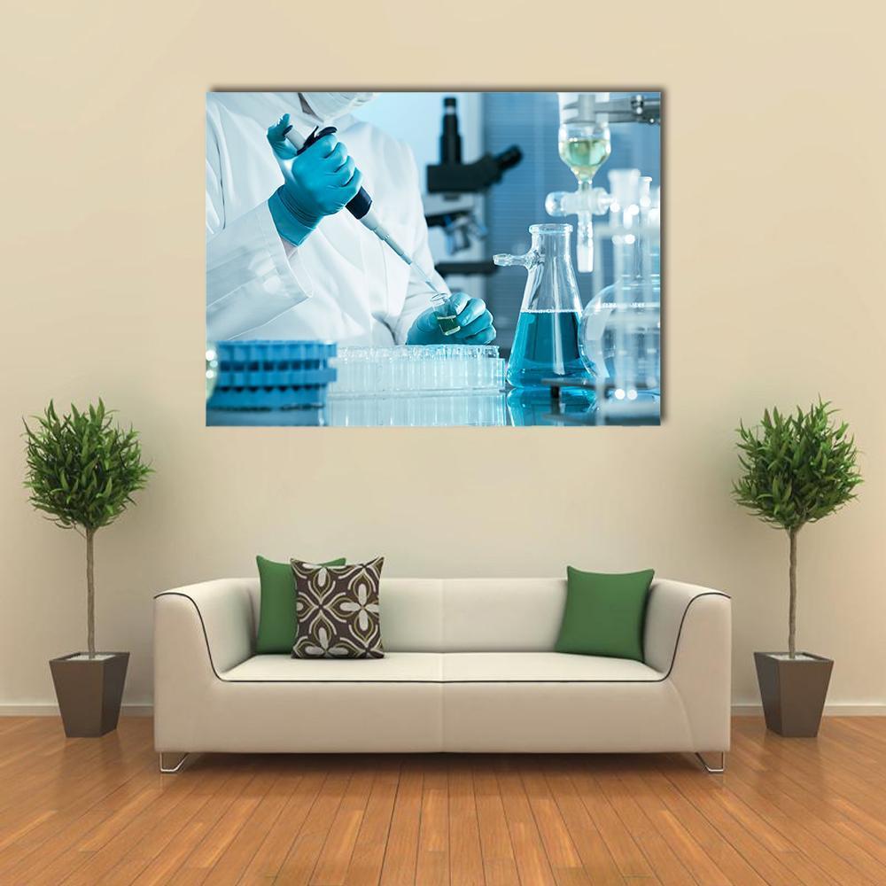 Scientist Using Pipette in Laboratory Canvas Wall Art in white and blue, single panel hung on a wall