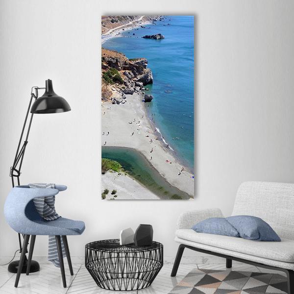 Greek Beach with River Mouth Vertical Canvas Wall Art in beige, brown and blue, single vertical panel hung on a wall