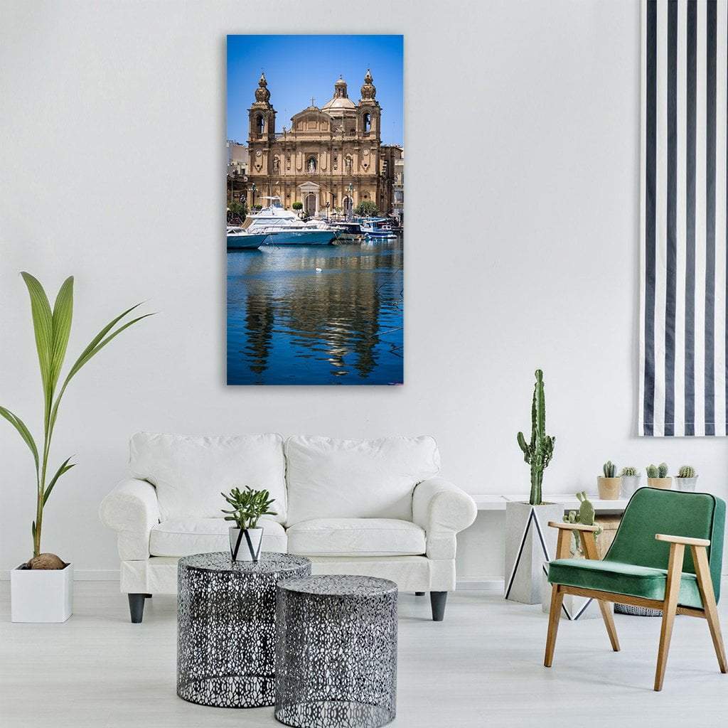 Boat at Baroque Church in Malta Vertical Canvas Wall Art in beige, brown and blue, single vertical panel hung on a wall