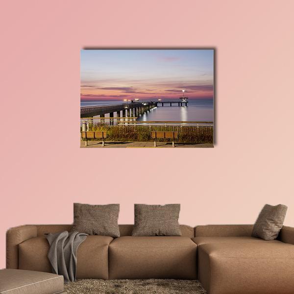 Burgas Bay Pier at Sunset Canvas Wall Art in orange, blue and pink, single panel hung on a wall