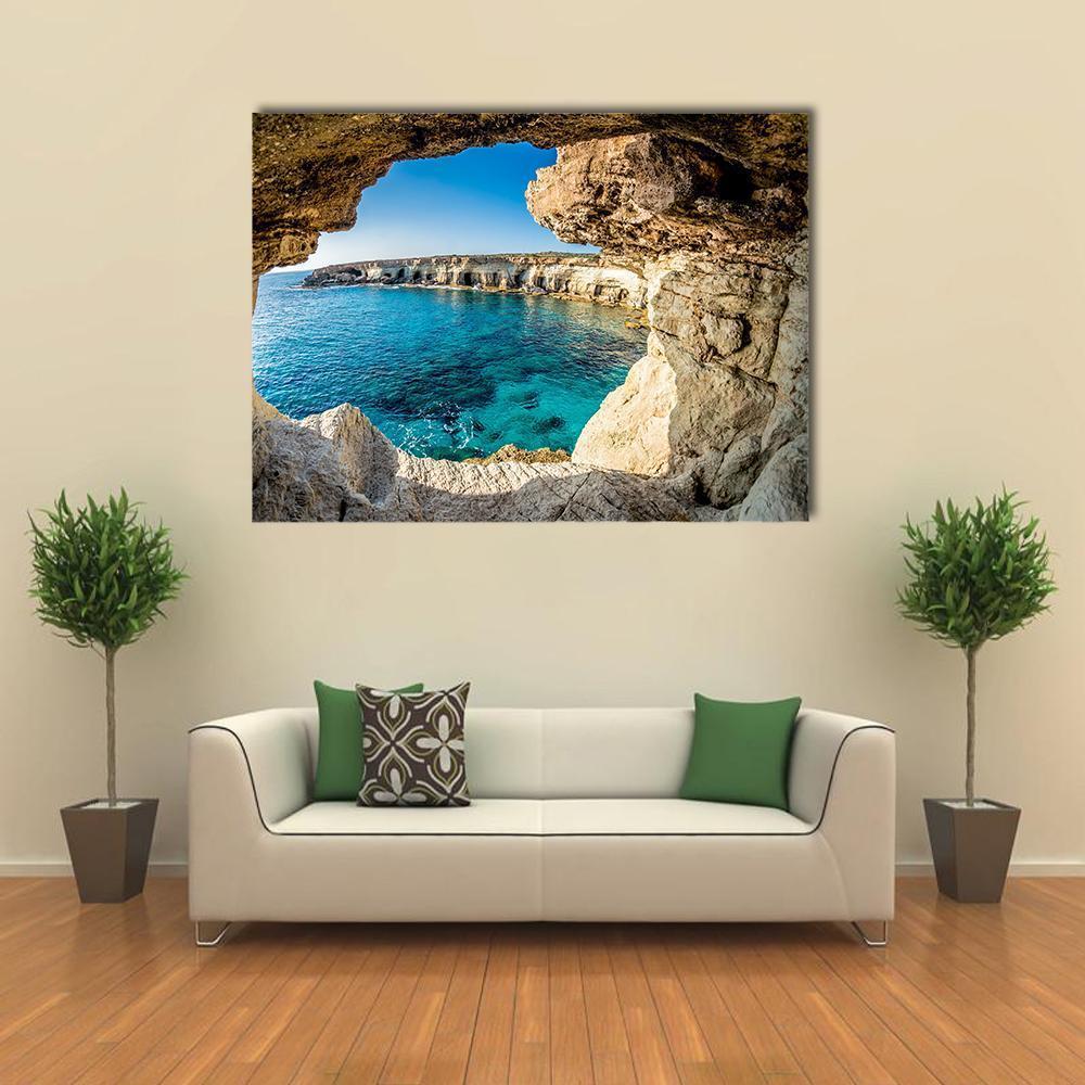 Sea Caves of Ayia Napa, Cyprus Canvas Wall Art in beige, brown and blue, single panel hung on a wall