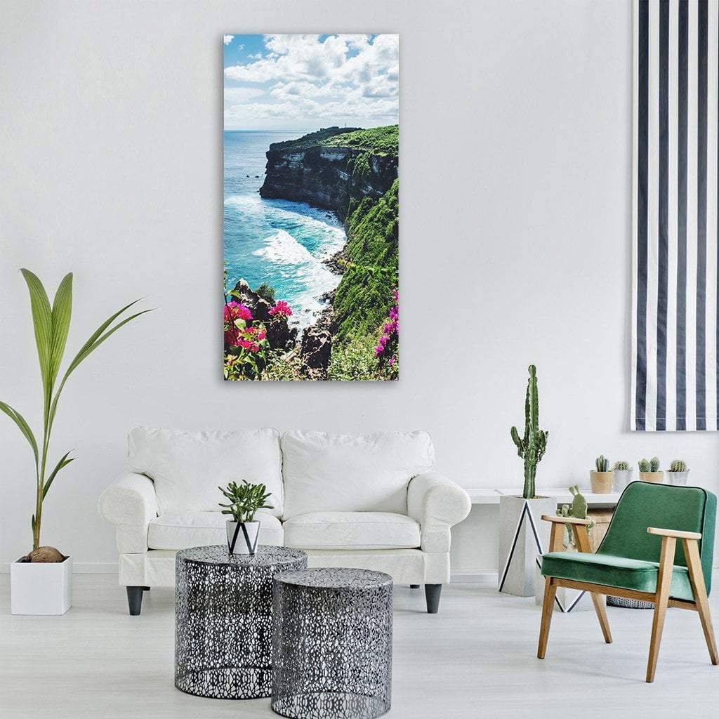 Turquoise Sea and Verdant Cliffs Vertical Canvas Wall Art in green and blue, single vertical panel hung on a wall
