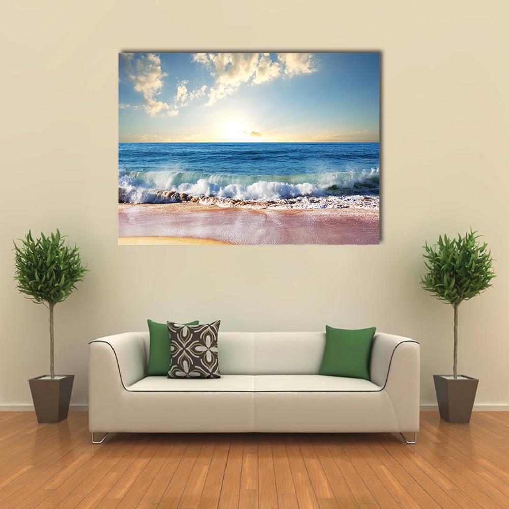 Sunrise Over Crashing Waves Canvas Wall Art in white, yellow and blue, single panel hung on a wall