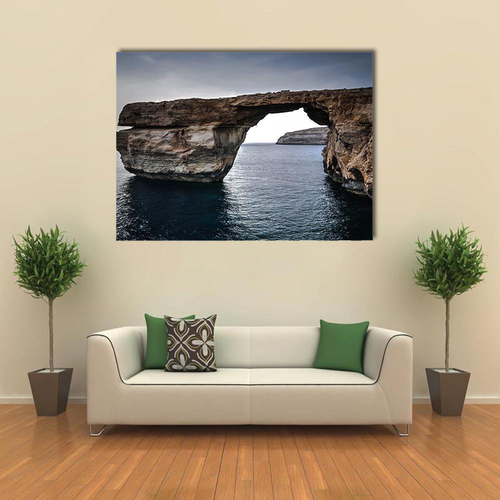 Natural Sea Arch by Cliffs Canvas Wall Art in gray, brown and blue, single panel hung on a wall