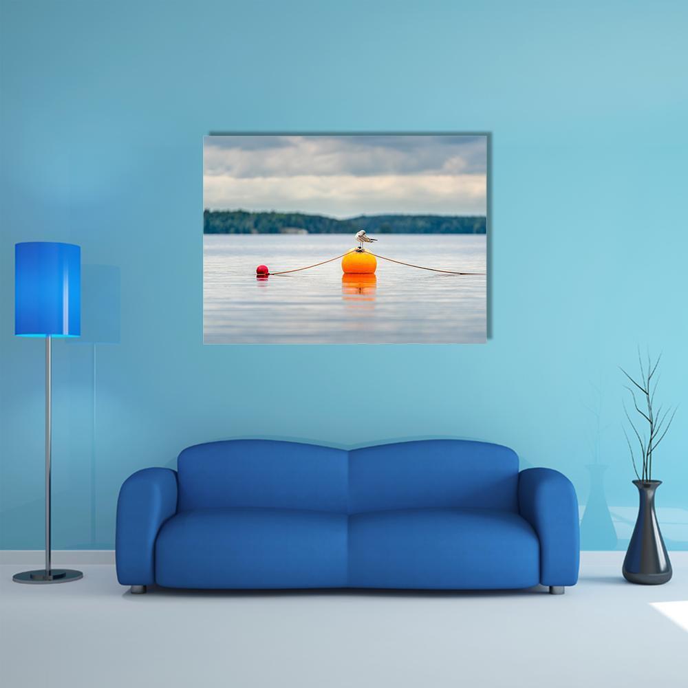 Seagull on Orange Buoy Canvas Wall Art in gray, orange and blue, single panel hung on a wall