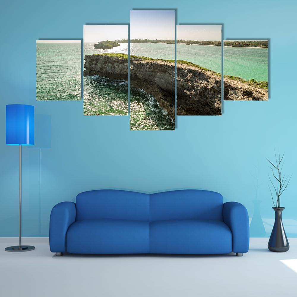 Seascape with Cliffs and Crashing Waves Canvas Wall Art in brown, green and blue, 5 panel Star layout hung on a wall