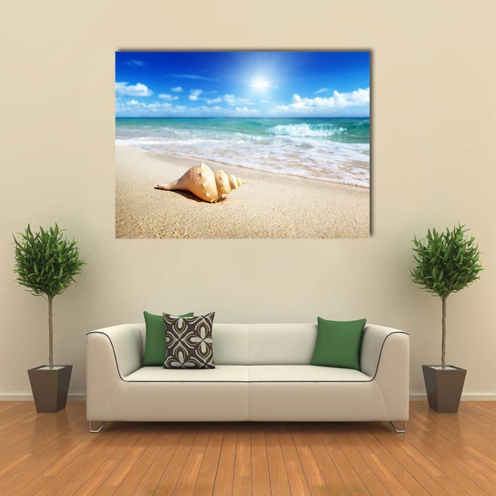 Seashell on the Beach Canvas Wall Art in white, beige and blue, single panel hung on a wall