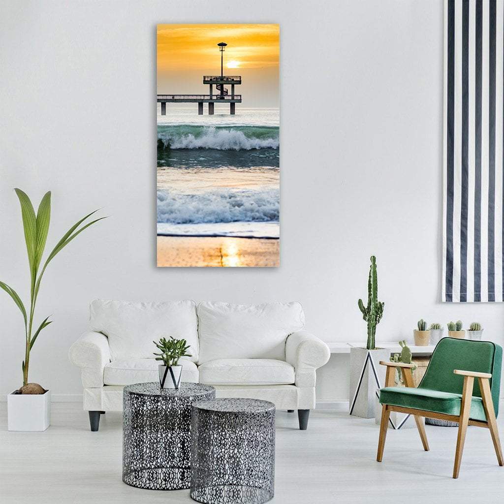 Seashore at Sunset Vertical Canvas Wall Art in orange, yellow and blue, single vertical panel hung on a wall