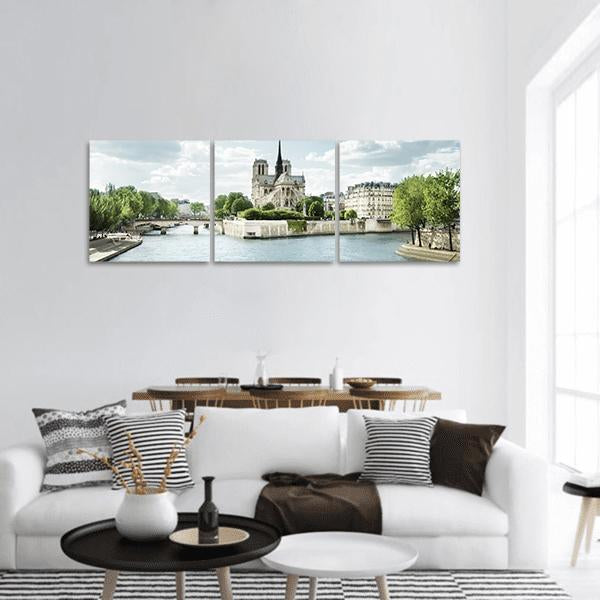Notre Dame and the Seine, Paris Panoramic Canvas Wall Art in white, green and blue, hung on a wall