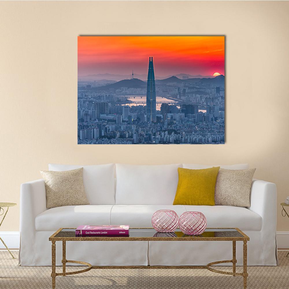 Seoul Skyline at Sunset Canvas Wall Art in orange, blue and pink, single panel hung on a wall