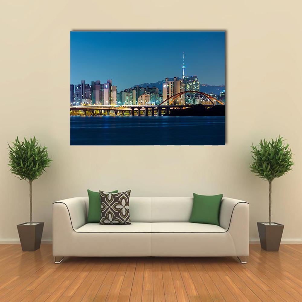 Seoul City Skyline at Night Canvas Wall Art in yellow, blue and navy, single panel hung on a wall
