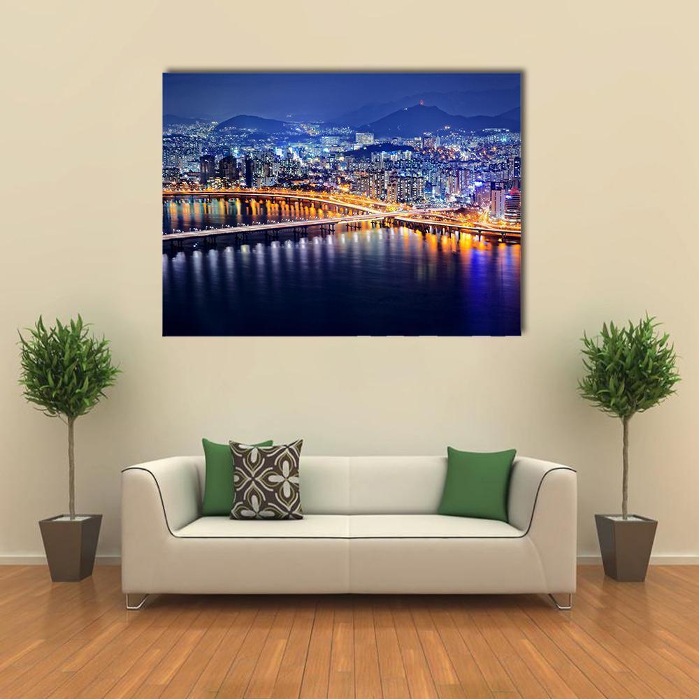 Seoul Tower and Downtown Skyline at Night Canvas Wall Art in yellow, blue and navy, single panel hung on a wall