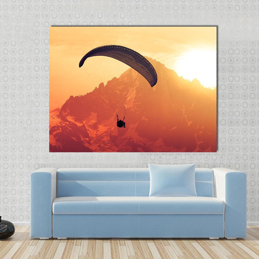 Sepia Paraglider Silhouette Over Alps Peaks Canvas Wall Art in brown, orange and yellow, single panel hung on a wall