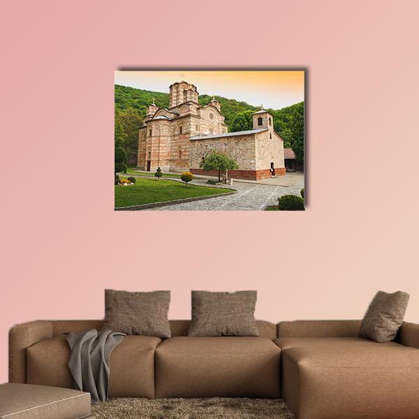 Ravanica Serbian Orthodox Monastery at Sunset Canvas Wall Art in brown, orange and green, single panel hung on a wall
