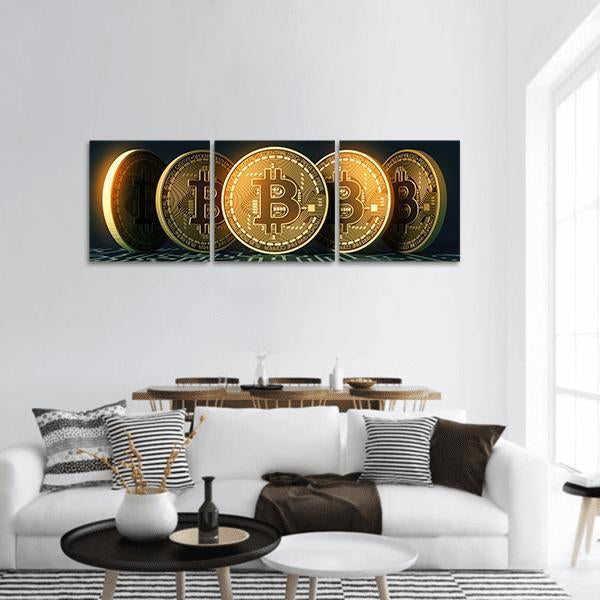 Five Golden Bitcoin Tokens Panoramic Canvas Wall Art in black and gold, single panel hung on a wall