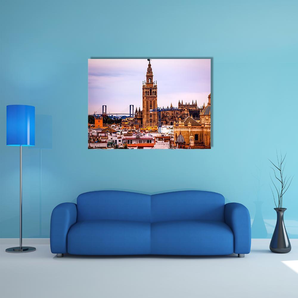 Giralda Tower at Seville Cathedral Canvas Wall Art in brown, orange and blue, single panel hung on a wall