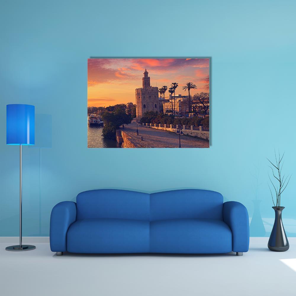 Seville Sunset Skyline Canvas Wall Art in orange, yellow and pink, single panel hung on a wall