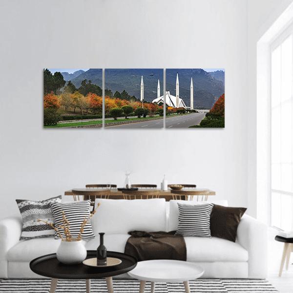 Shah Faisal Mosque Islamabad Panoramic Canvas Wall Art in white, green and blue, hung on a wall
