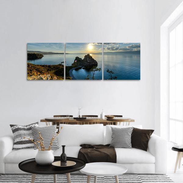 Shaman Rock on Lake Baikal Panoramic Canvas Wall Art in white, brown and blue, hung on a wall