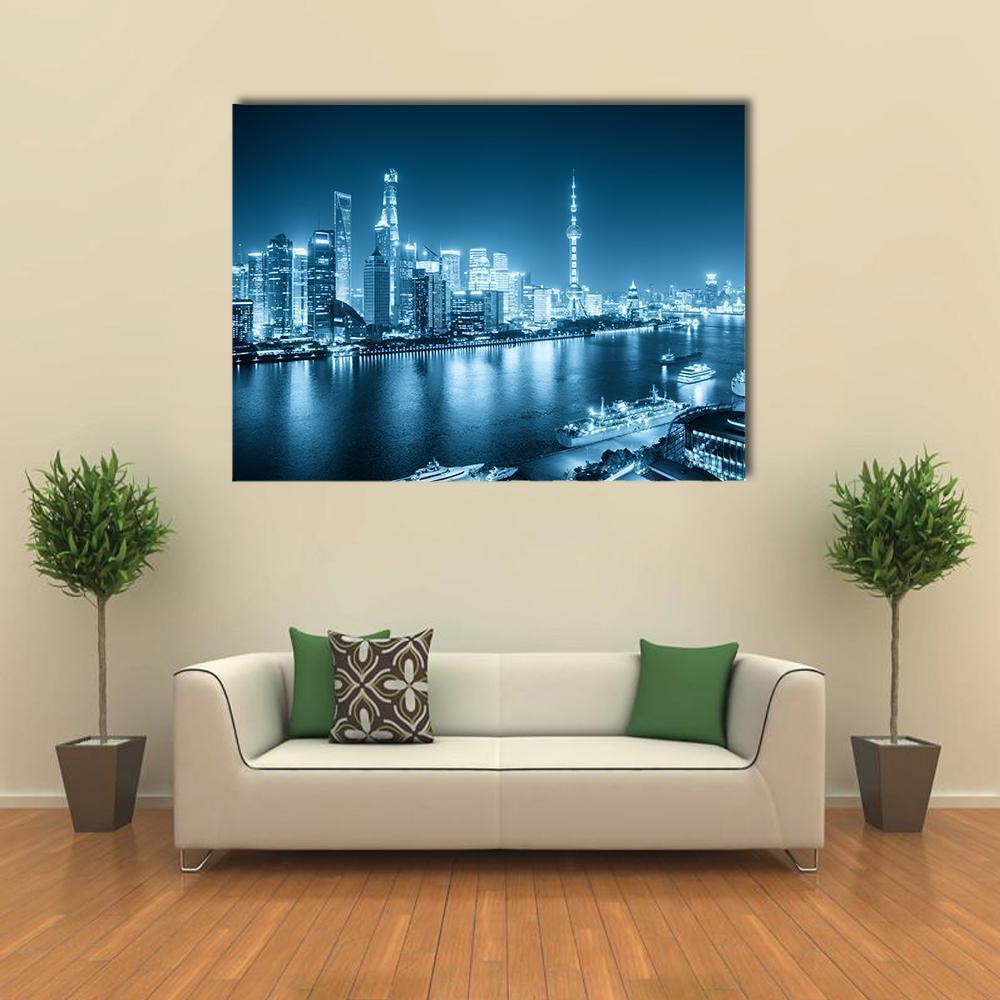 Shanghai Skyline at Night Canvas Wall Art in white, blue and navy, single panel hung on a wall