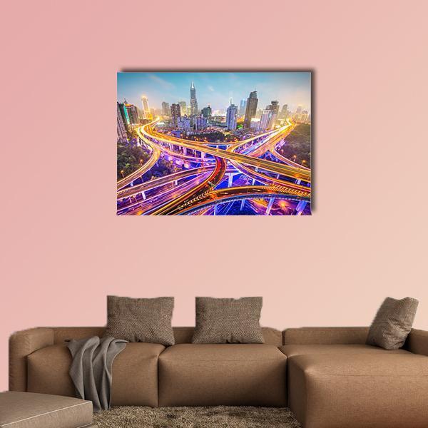 Shanghai Highway Interchange at Night Canvas Wall Art in yellow, blue and purple, single panel hung on a wall