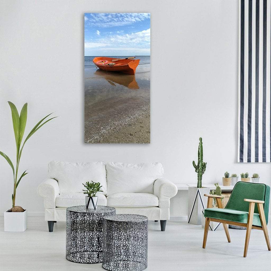 Orange Boat on Sandy Shore Vertical Canvas Wall Art in beige, orange and blue, single vertical panel hung on a wall