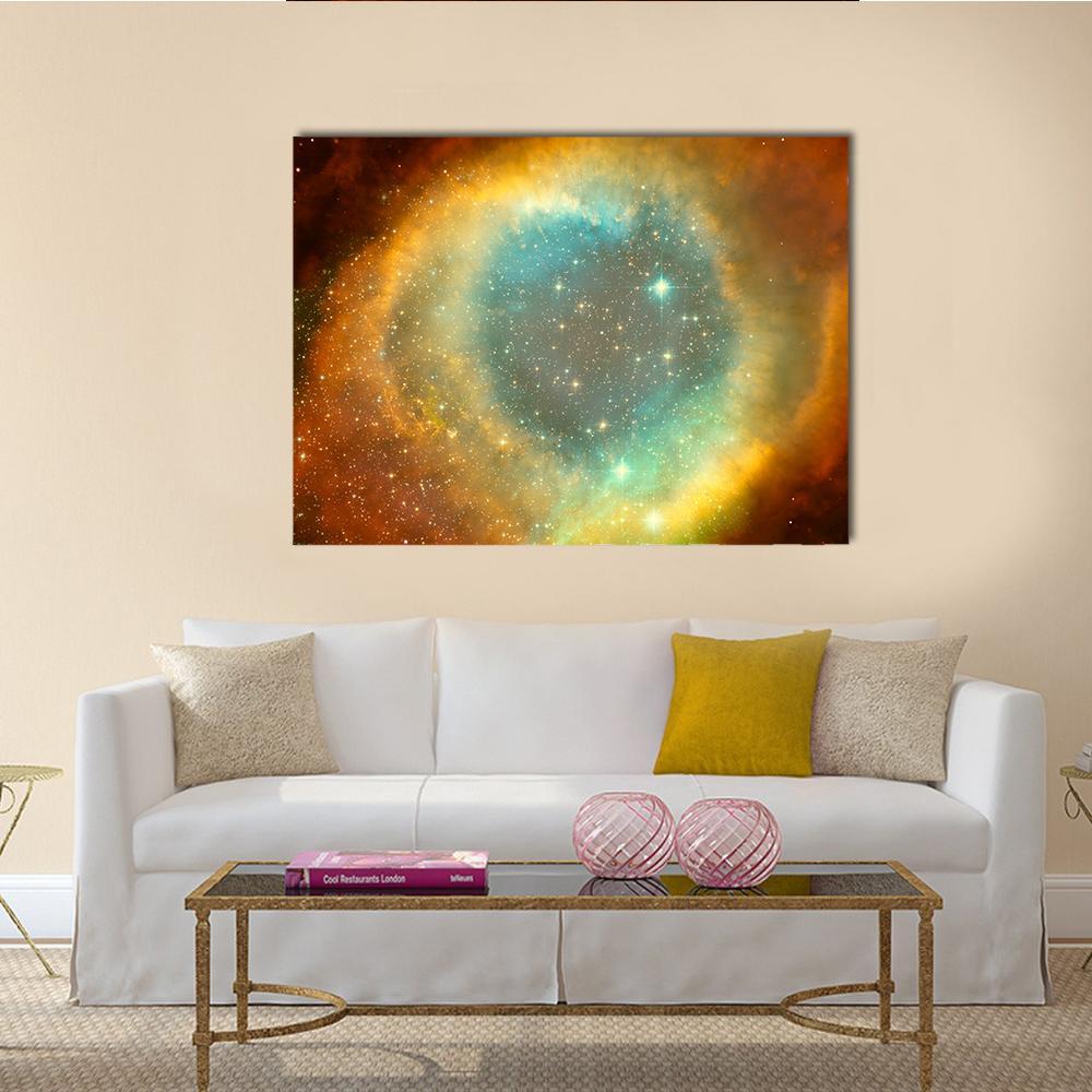 Nebula and Star Field Canvas Wall Art in orange, yellow and blue, single panel hung on a wall