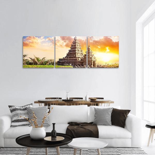Shore Temple at Mamallapuram Panoramic Canvas Wall Art in brown, orange and yellow, hung on a wall
