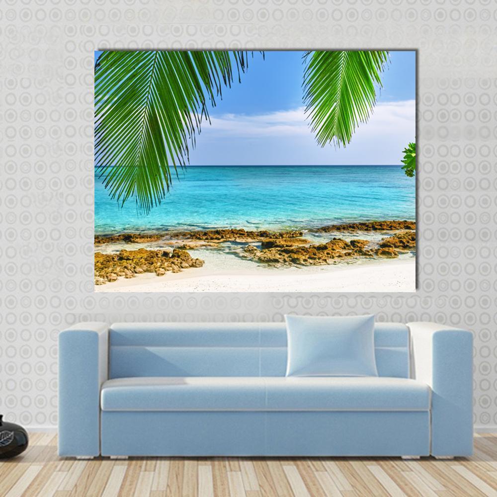 Shoreline of a Tropical Island in the Maldives Canvas Wall Art in white, green and blue, single panel hung on a wall