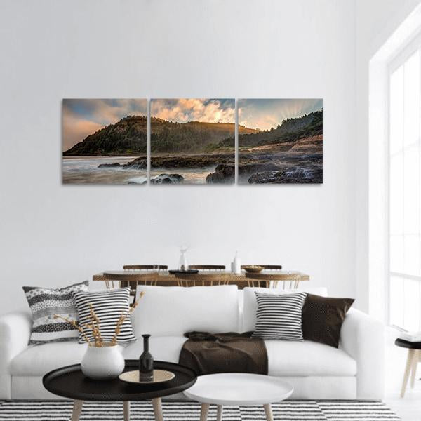 Oregon Coast Shoreline at Sunset Panoramic Canvas Wall Art in brown, orange and blue, hung on a wall
