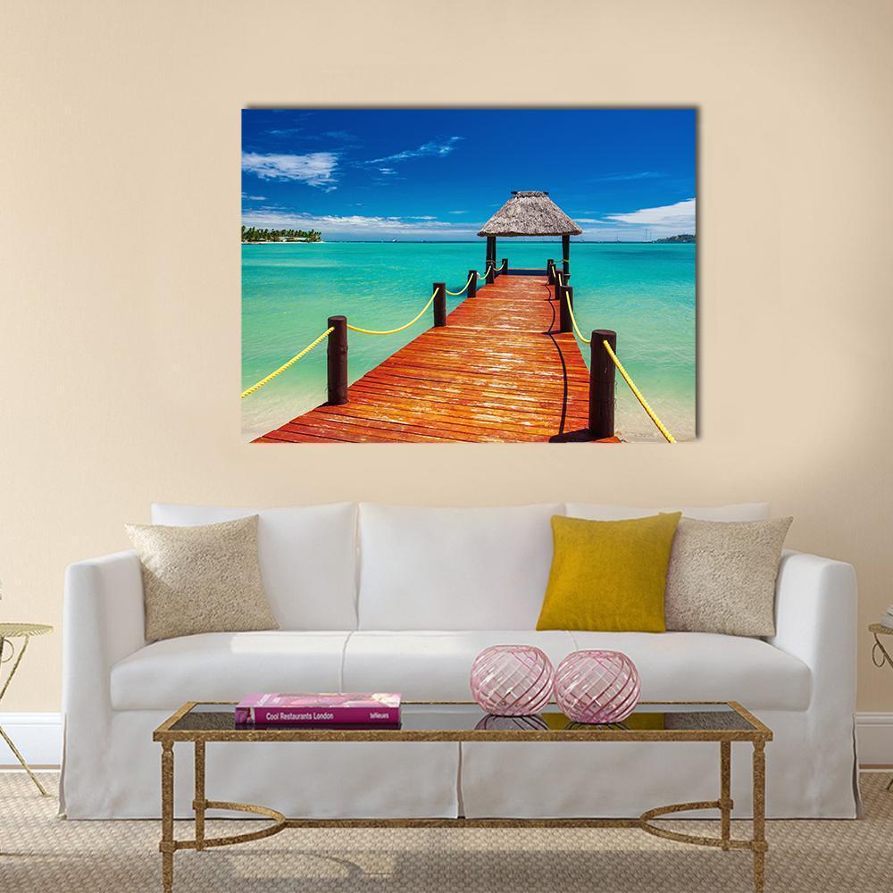 Red Wooden Jetty on Tropical Fiji Island Canvas Wall Art in brown, red and blue, single panel hung on a wall