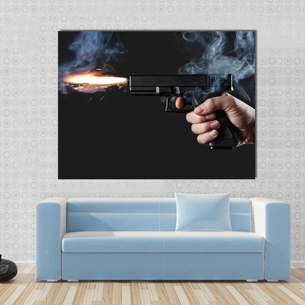 Gun Firing Muzzle Flash with Smoke Canvas Wall Art in black, gray and orange, single panel hung on a wall
