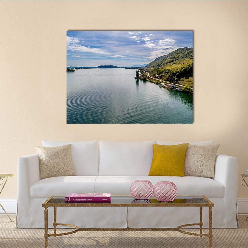 Aerial Lake View Over Steep Shoreline Canvas Wall Art in green and blue, single panel hung on a wall