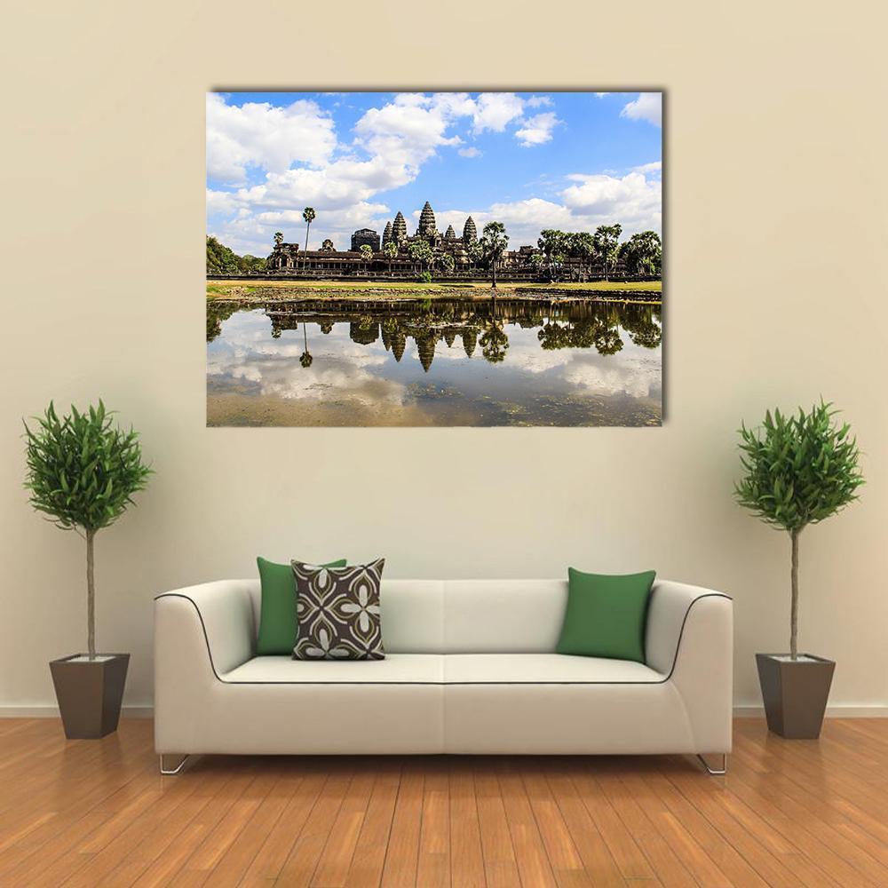 Angkor Wat Temple with Lake Reflection Canvas Wall Art in white, green and blue, single panel hung on a wall