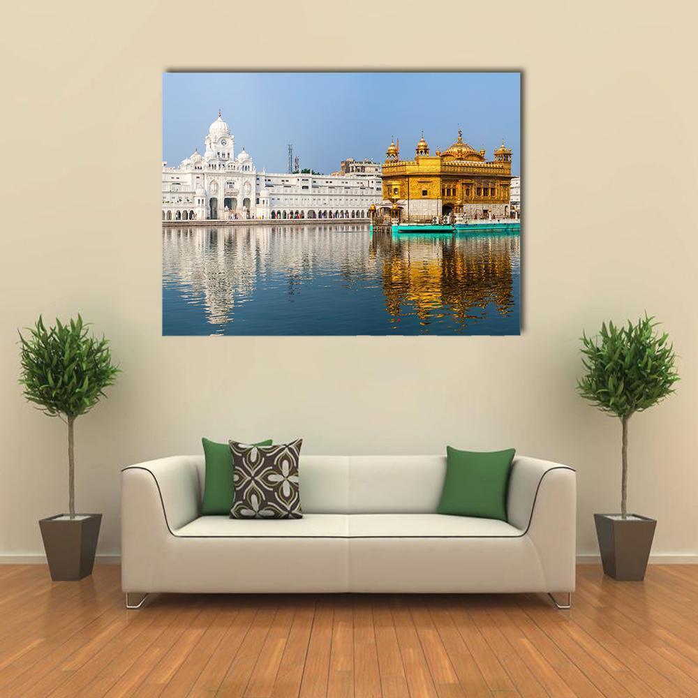 Golden Temple Reflections in India Canvas Wall Art in white, gold and blue, single panel hung on a wall