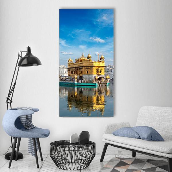 Golden Temple at Amritsar Vertical Canvas Wall Art in gold, yellow and blue, single vertical panel hung on a wall