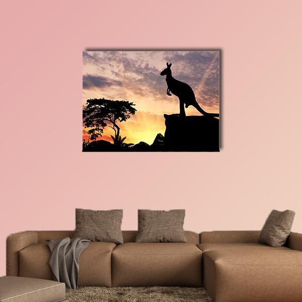 Kangaroo Silhouette on Cliff at Sunset Canvas Wall Art in black, orange and yellow, single panel hung on a wall