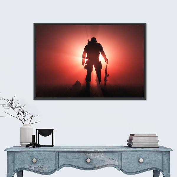 Soldier Silhouette at Sunrise Canvas Wall Art in black, red and orange, framed canvas, product view on a white background