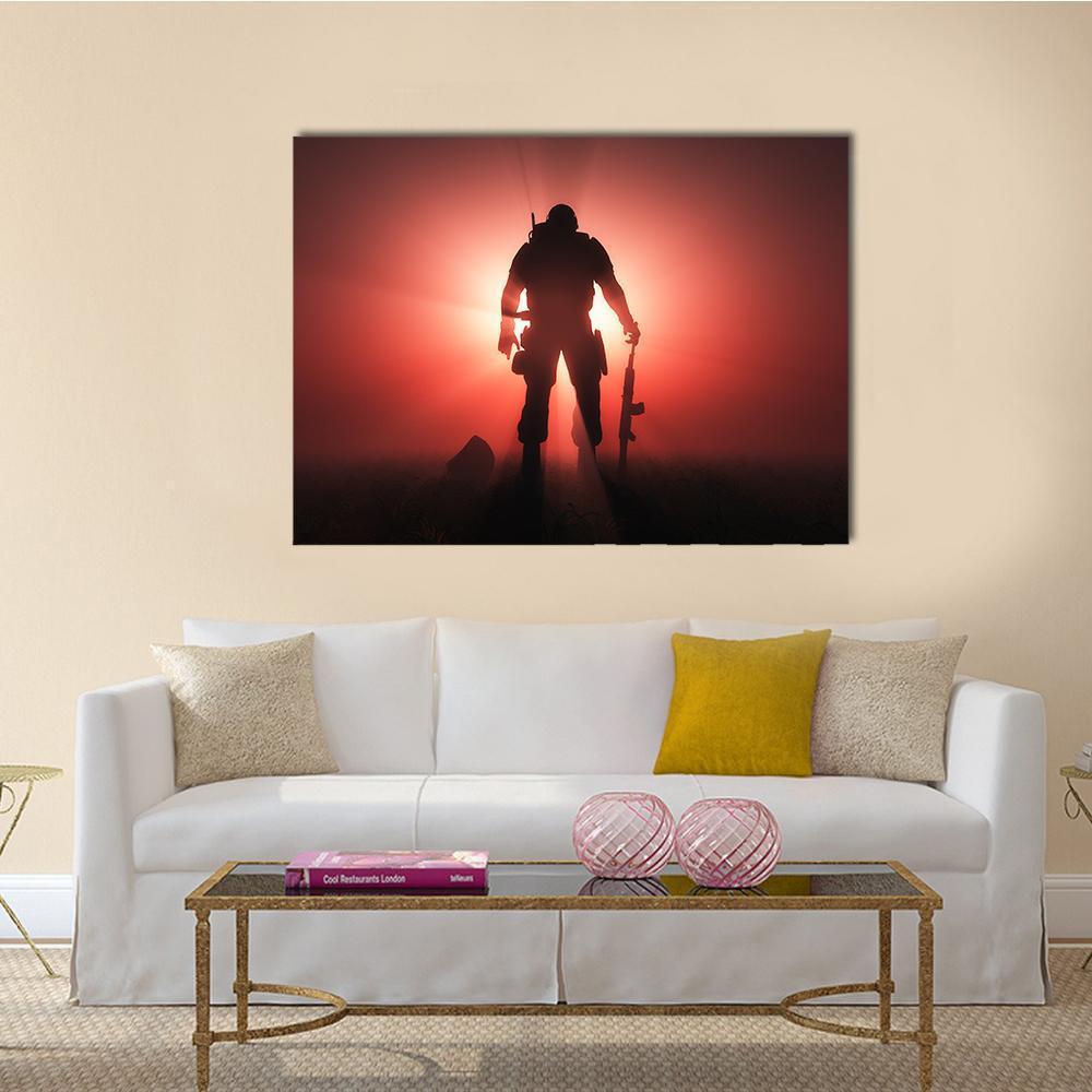 Soldier Silhouette at Sunrise Canvas Wall Art in black, red and orange, single panel hung on a wall