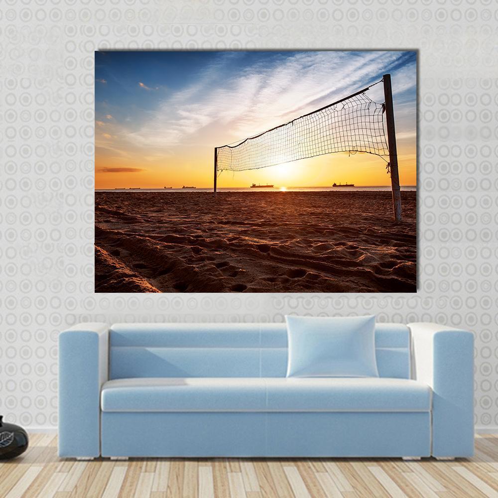 Beach Volleyball Net at Sunset Canvas Wall Art in brown, orange and blue, single panel hung on a wall