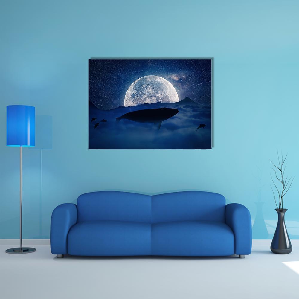 Moonlit Whale Silhouette Canvas Wall Art in white, blue and navy, single panel hung on a wall